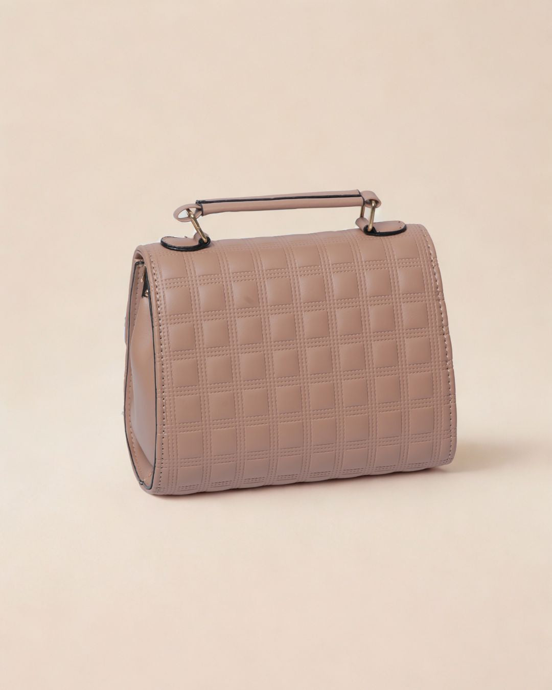 Beige handbag with a textured pattern on a beige background