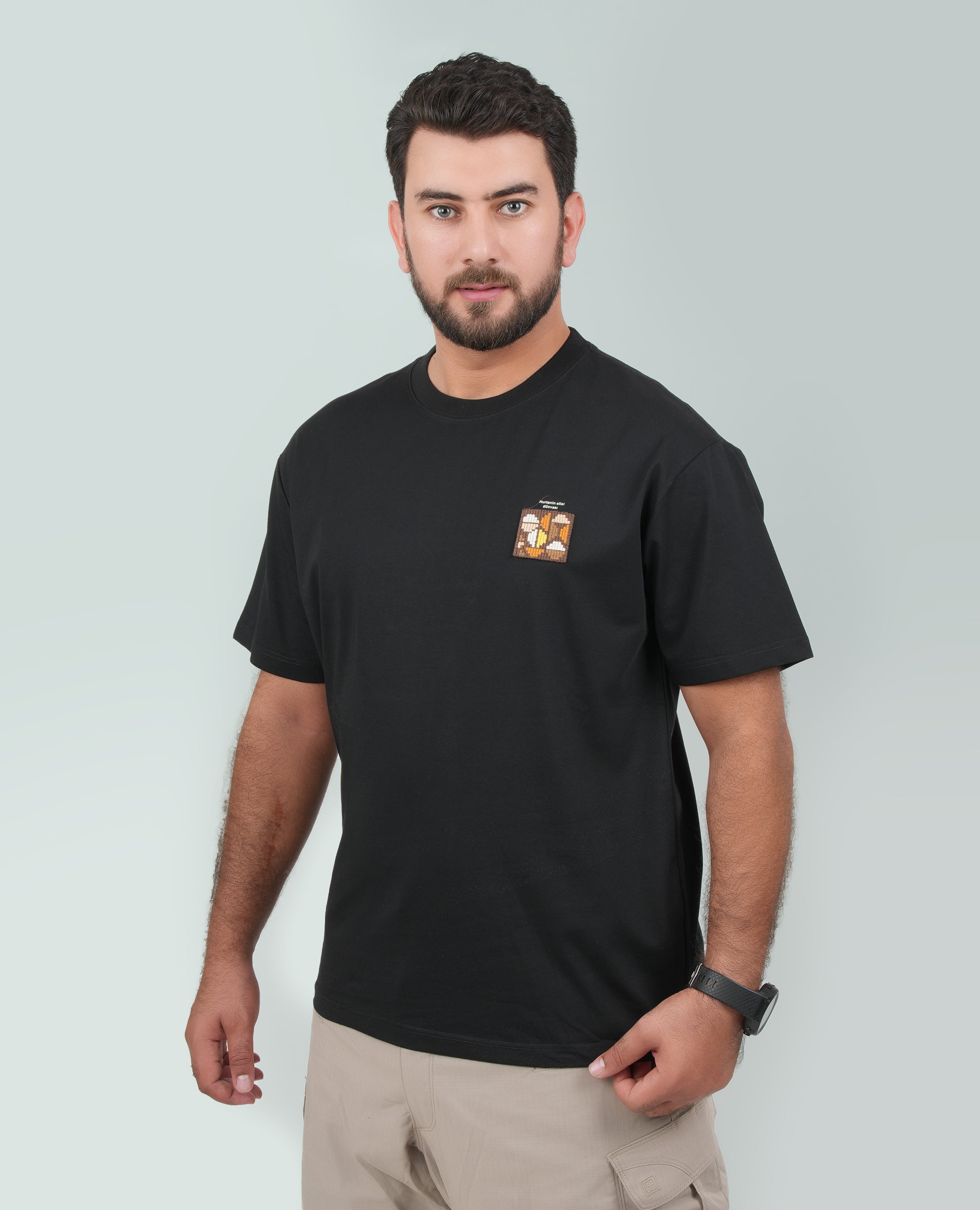 Men’s Solid T-Shirt – Cross-Stitch Pattern with Minimal Front & Back Text.