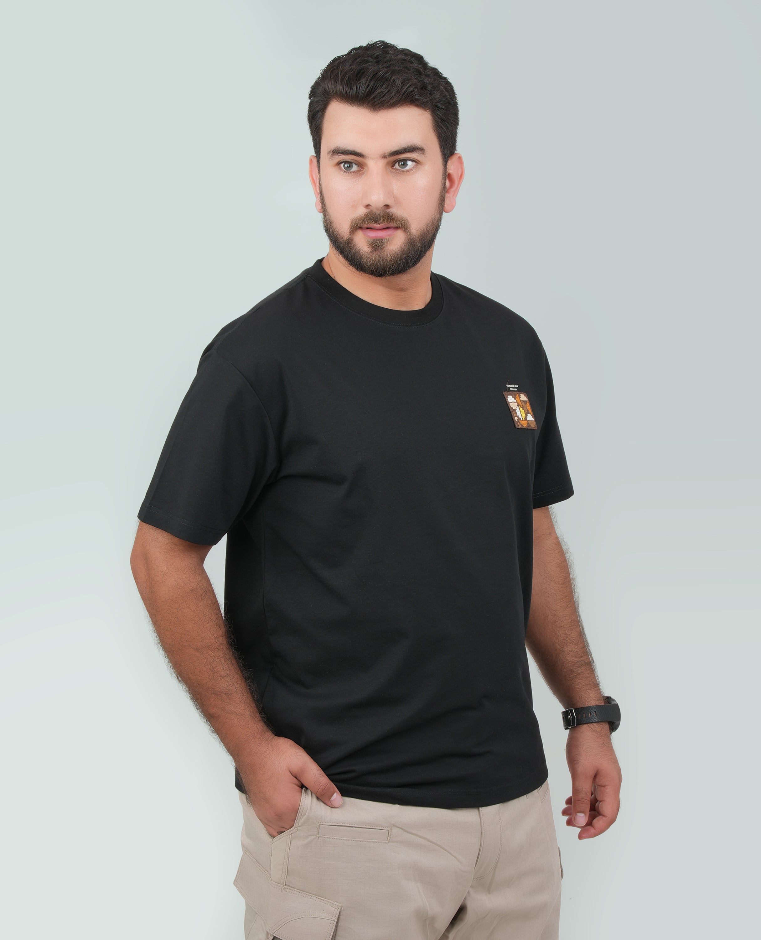 Men’s Solid T-Shirt – Cross-Stitch Pattern with Minimal Front & Back Text.