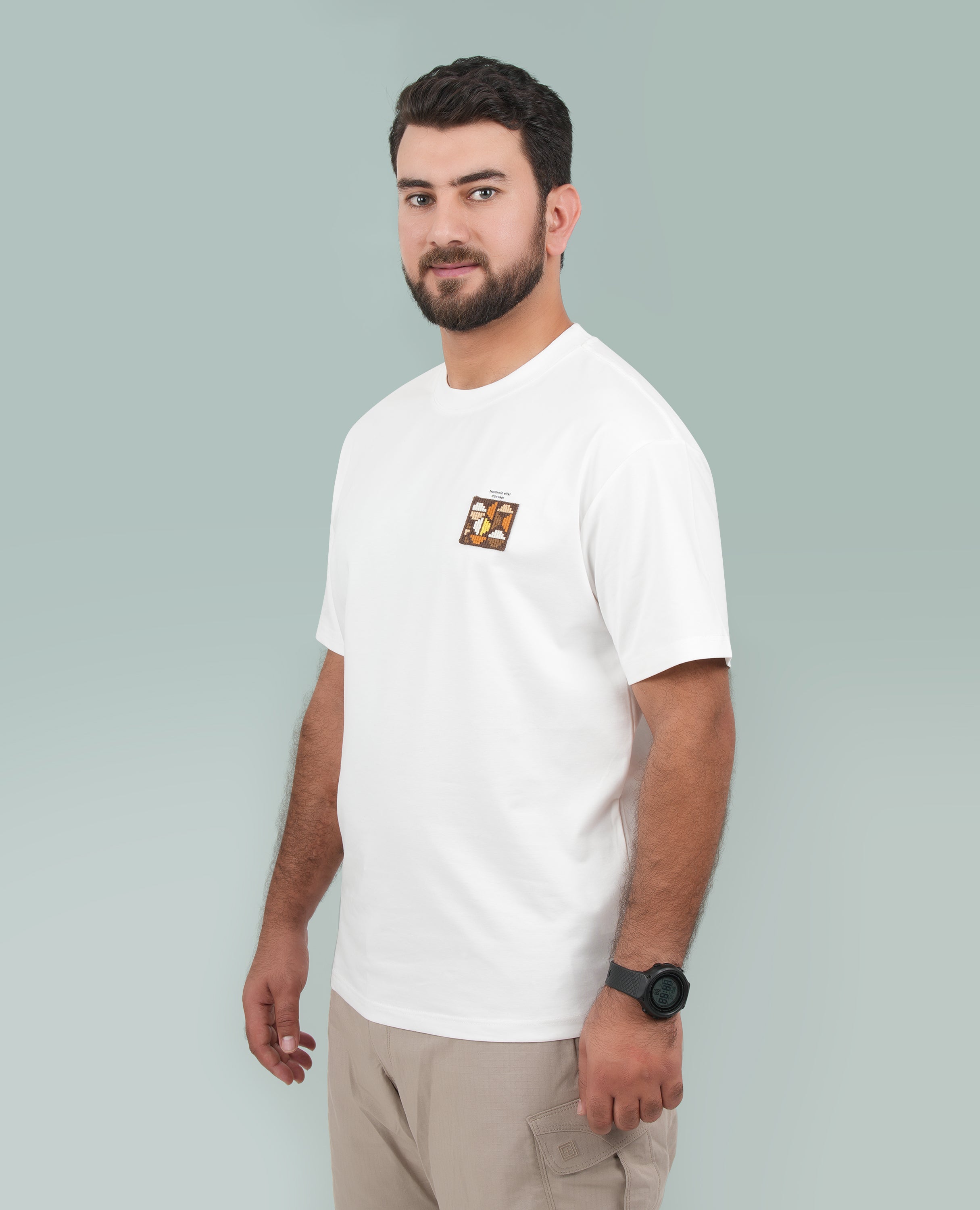 Men’s Solid T-Shirt – Cross-Stitch Pattern with Minimal Front & Back Text.