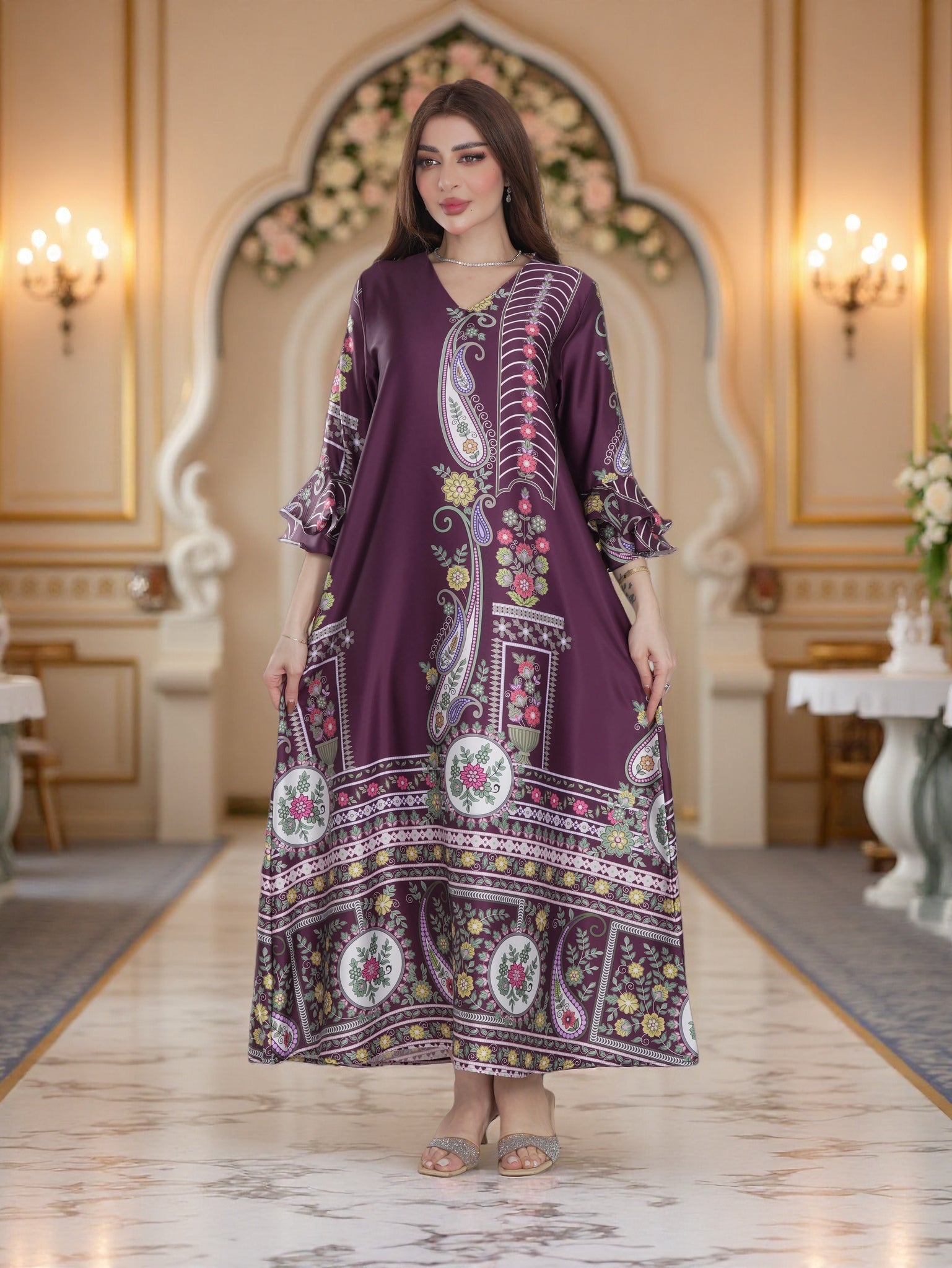 Woman wearing a long, patterned dress in an elegant indoor setting.